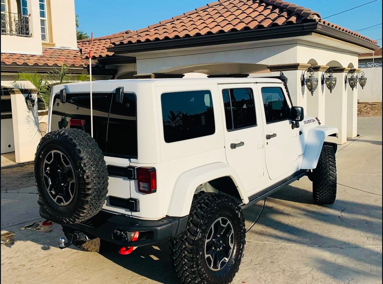 White Jeep Wrangler Rubicon washed and dressed at a client's home