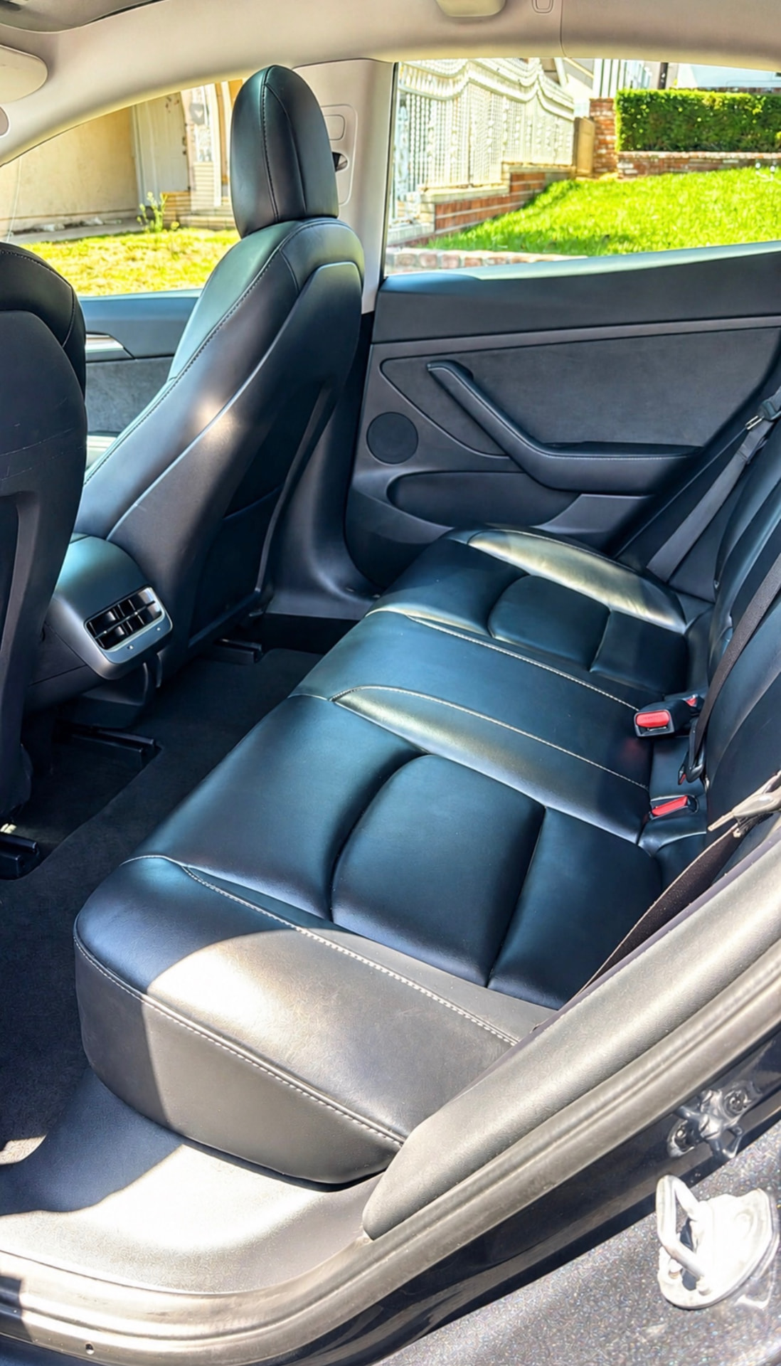 Tesla Model 3 rear leather seats after a deep interior detail